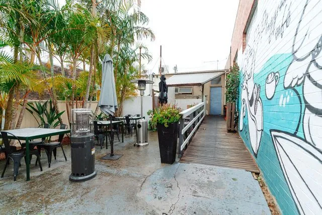 Playground Cafe's welcoming outdoor dining space and colourful mural